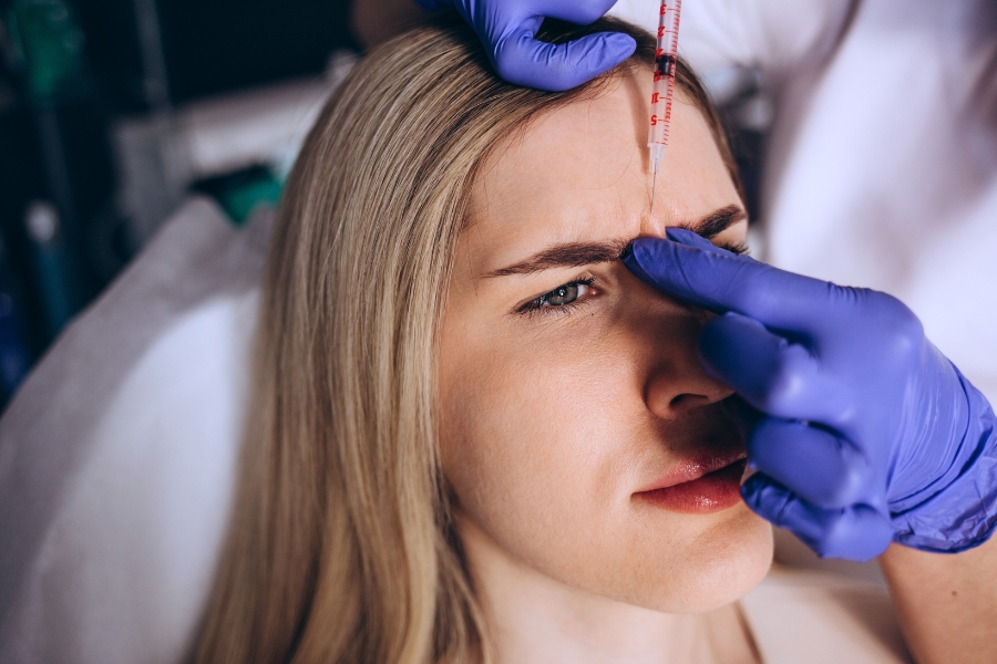 injecting Botox between eyebrows